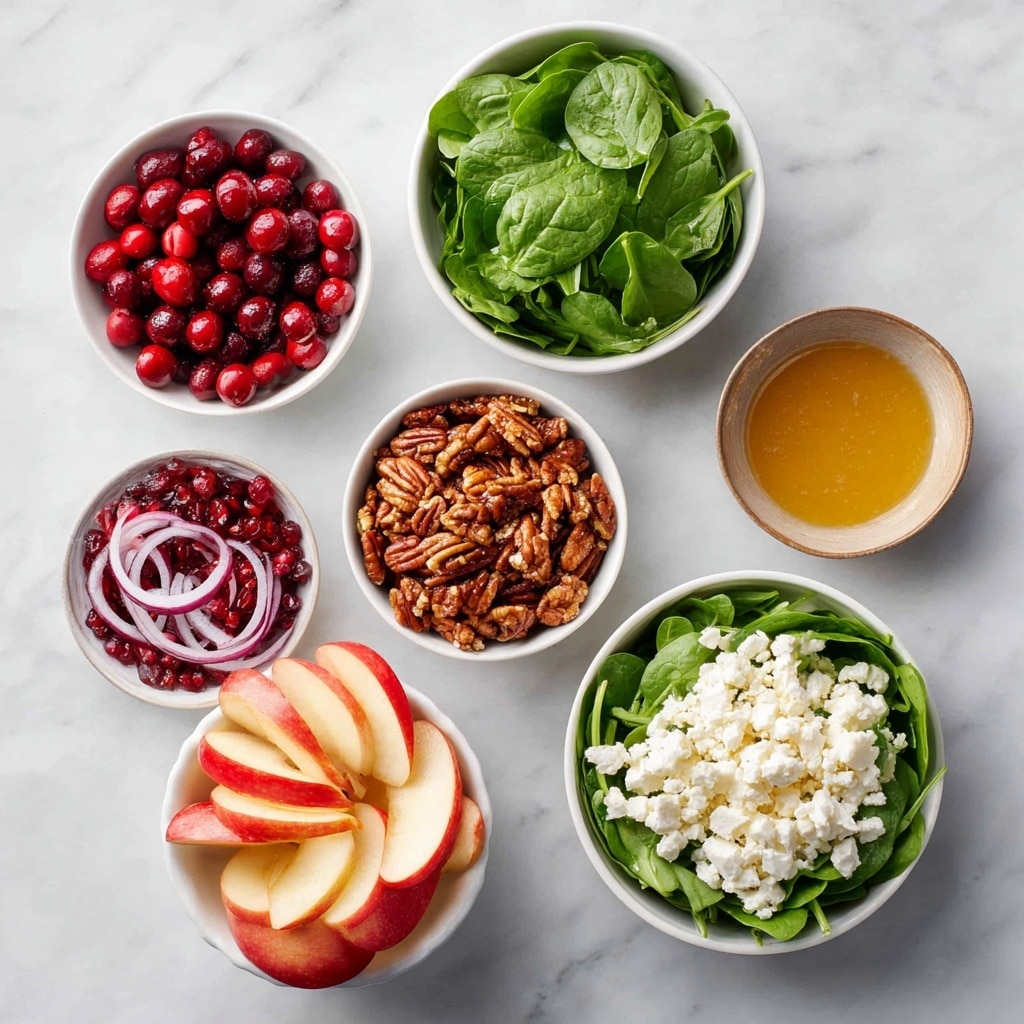 A white bowl filled with a fresh salad made of dark green leafy arugula as the base layer, topped with small light green avocado chunks, bright red pomegranate seeds, and pale yellow pineapple pieces scattered evenly. On top, pieces of crumbled white cheese and rough chopped brown walnuts are spread across, with a light drizzle of golden dressing giving a shiny texture. The bowl sits on a white marbled surface, and the overall look is colorful and fresh, showing a mix of soft, crunchy, and juicy textures clearly visible. Photo taken with an iphone --ar 4:5 --v 7