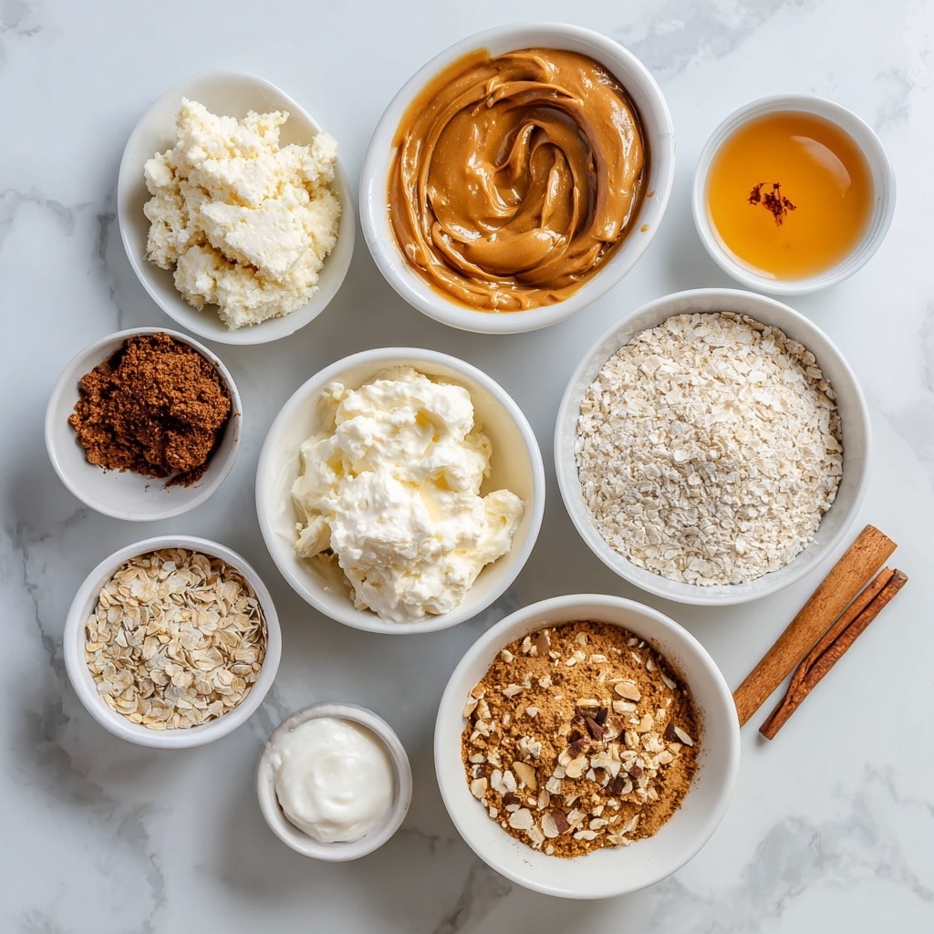 A white plate holds a pyramid of smooth, round brown balls, each with a shiny surface that reflects light. The balls are stacked in multiple layers, creating a neat triangular shape. On top of each ball is a light dusting of fine brown powder, adding texture and contrast to the smoothness below. The scene is set on a white marbled surface, enhancing the warm brown tones of the balls. photo taken with an iphone --ar 4:5 --v 7