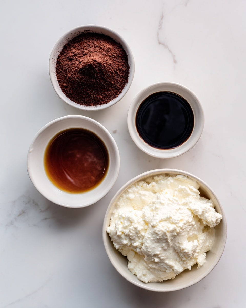 Four small white bowls sit on a white marbled surface evenly spaced apart. One bowl is filled with dark brown cocoa powder with a slightly rough texture on top. Another bowl contains smooth, dark amber-colored honey, shiny and thick. A third bowl holds a dark liquid labeled vanilla extract, almost black with a glossy surface. The largest bowl, placed to the right, is filled with creamy white cottage cheese showing a slightly lumpy texture. Each bowl has a small label beside it with simple text naming their contents. Photo taken with an iphone --ar 4:5 --v 7