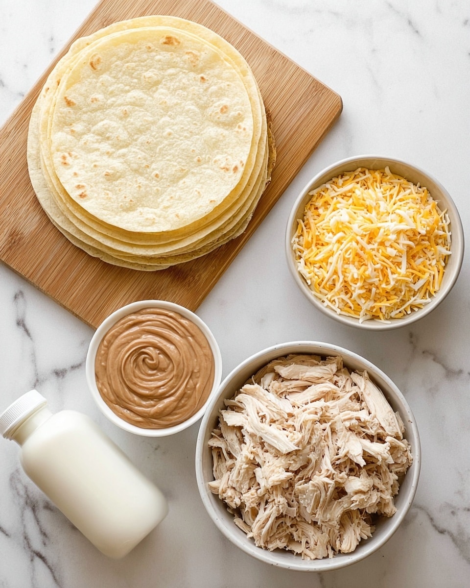 The image shows a top view of cooking ingredients neatly arranged on a white marbled surface. There is a stack of pale yellow soft tortillas placed on a wooden board at the top left corner. Below the board, a small round white bowl contains creamy brown refried beans with a swirl pattern on top. To the right, a small white bowl is filled with a mix of shredded yellow and white cheeses. A larger white bowl below the cheese holds a pile of shredded light beige cooked chicken. On the bottom left, there is a white plastic bottle, likely containing sour cream. photo taken with an iphone --ar 4:5 --v 7