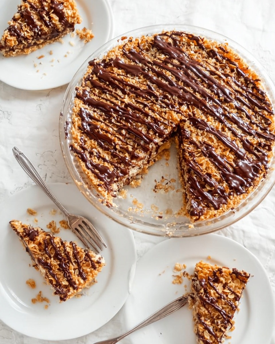 The image shows a round clear glass dish filled with a golden brown baked coconut topping that has a dry, slightly crispy texture. On top of this layer, there are several thick lines of smooth, dark chocolate drizzled evenly from top to bottom across the surface. The dish is placed on a white marbled surface, and a woman's hand is holding the edge of the dish. The colors focus on warm golden browns and rich dark chocolate with a glossy finish on the chocolate lines. photo taken with an iphone --ar 4:5 --v 7