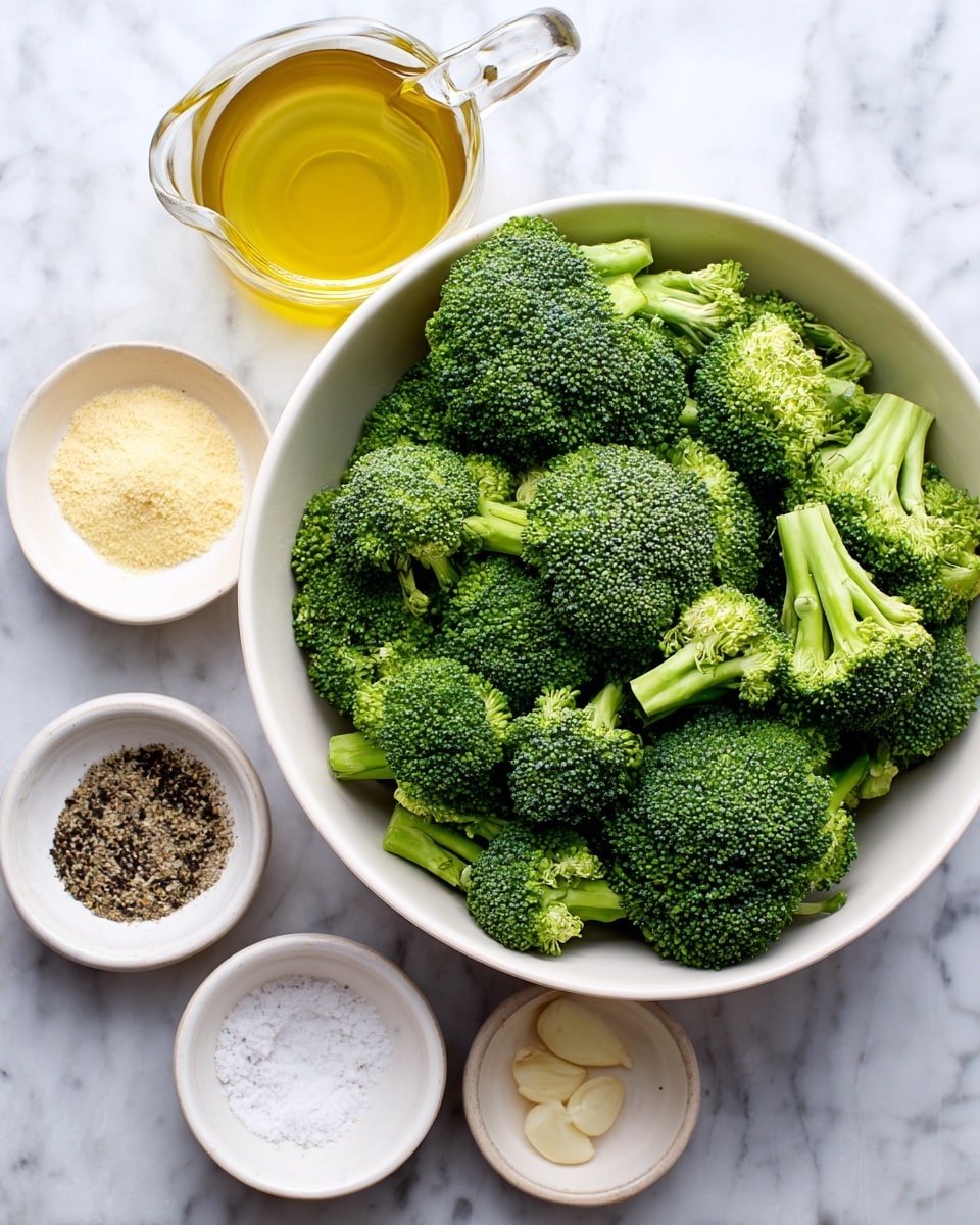 A large white bowl filled with fresh green broccoli florets sits on a white marbled surface. Around it, there are four small white bowls: the top right bowl contains pale yellow onion powder, the top left bowl has black pepper, the bottom left bowl holds light beige garlic powder, and the bottom middle bowl has white salt. To the left of the broccoli bowl, there is a small white jug filled with golden olive oil. All items are neatly arranged on the white marbled background. photo taken with an iphone --ar 4:5 --v 7