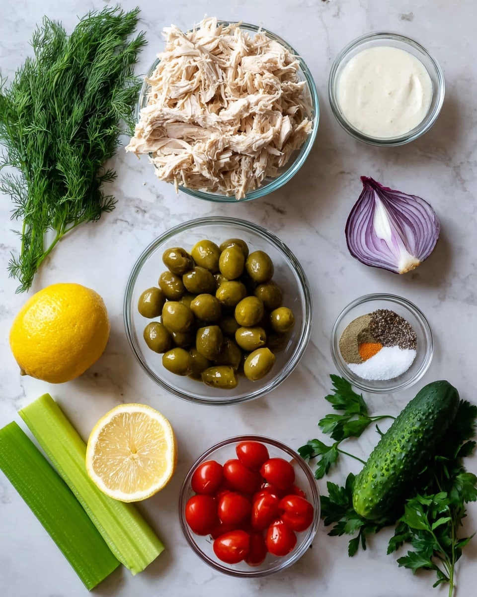 The image shows ingredients laid out on a white marbled surface: a clear glass bowl filled with shredded light beige cooked chicken, a pile of bright green olives below it, and a small glass bowl with a white creamy sauce. Around these are fresh vegetables and herbs including a bunch of dark green parsley, a bright yellow lemon, a quarter of a purple onion, a light green celery stalk, a dark green cucumber piece, a small bunch of leafy dill, and a glass bowl filled with shiny red cherry tomatoes. A tiny glass bowl holds a mix of white salt, black pepper, and beige garlic powder. photo taken with an iphone --ar 4:5 --v 7