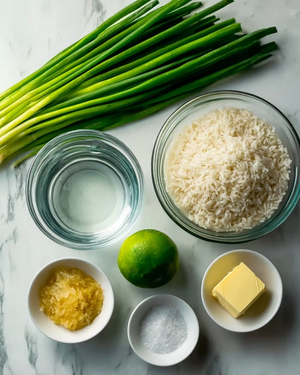 The image shows a white marbled surface with several ingredients arranged neatly. On the left, there is a bunch of green onions with long green stalks and white ends. Next to them is a clear glass bowl containing water. To the right of the water, there is another clear glass bowl filled with white rice. In front of the rice bowl is a whole lime, round and green. Below the lime, there are three small white bowls: the left one contains a yellow paste or crushed fruit, the middle one has white granulated sugar, and the right one holds a small piece of yellow butter. The whole scene is bright and clean. photo taken with an iphone --ar 4:5 --v 7