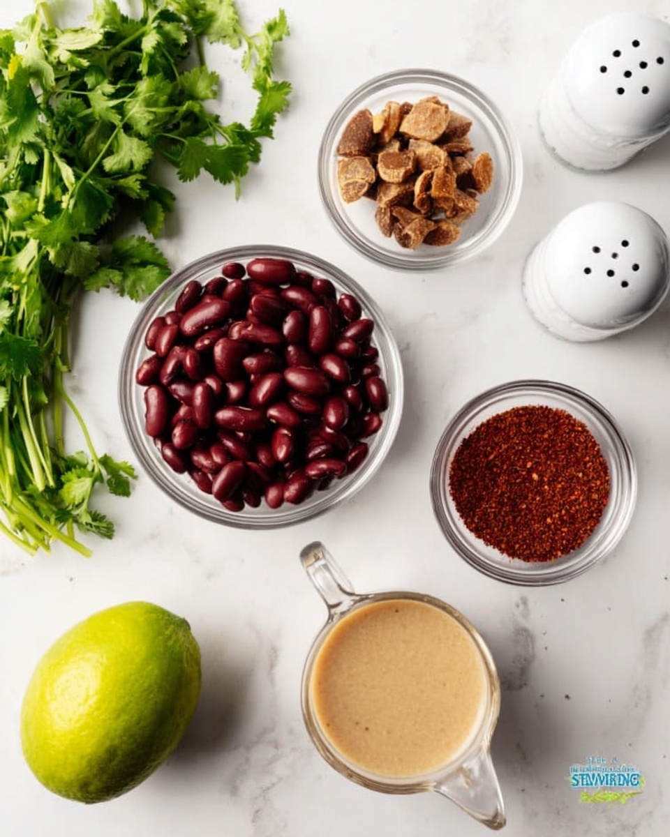 The image shows a white marbled surface with several small clear glass bowls arranged neatly. One bowl is filled with dark red kidney beans, another with dried brown slices, a third holds a red spice powder, and a fourth contains a brownish spice. A small clear glass cup filled with a beige liquid is also present. Two white shakers, likely for salt and pepper, are seen in the upper right corner. Fresh green cilantro sprigs lie on the bottom left, next to a whole light green lime. The scene is bright and clean, with all items spaced evenly. photo taken with an iphone --ar 4:5 --v 7