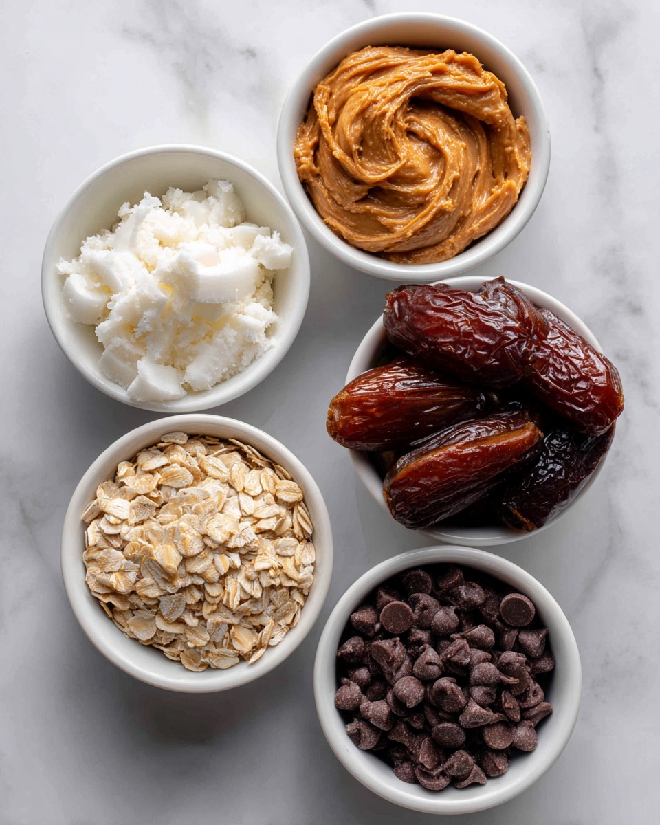 Five white bowls sit on a white marbled surface, each filled with different ingredients for a recipe. The top left bowl has white coconut oil with a soft, solid texture. Next to it, a bowl holds smooth, creamy peanut butter in an orange-brown shade. On the top right, a bowl is filled with brown medjool dates, which look wrinkled and sticky. The bottom left bowl contains light beige rolled oats with a rough texture, and the bottom right bowl is filled with dark brown, round chocolate chips. The bowls are arranged in a loose cluster. photo taken with an iphone --ar 4:5 --v 7