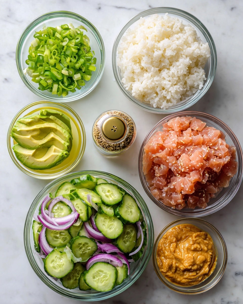 The image shows seven clear glass bowls of different sizes arranged on a white marbled surface. The largest bowl at the top right holds fluffly white sushi rice. To its left is a small bowl filled with bright green spring onion slices. Below the rice is a small bowl with thin light green avocado slices fanned out. Below the avocado is an even smaller bowl with pale yellow olive oil. On the bottom left is a large bowl filled with green cucumber salad with whole cucumber pieces and thin purple onion rings. Next to it on the right is a medium bowl holding smooth, thick orange bang bang sauce. Above the cucumber salad and to the left of the rice is a medium bowl filled with light pink flaky tuna. In the center of the image sits a small glass bottle of furikake seasoning with a gold lid. All bowls are transparent and the setup looks neat and bright. Photo taken with an iphone --ar 4:5 --v 7