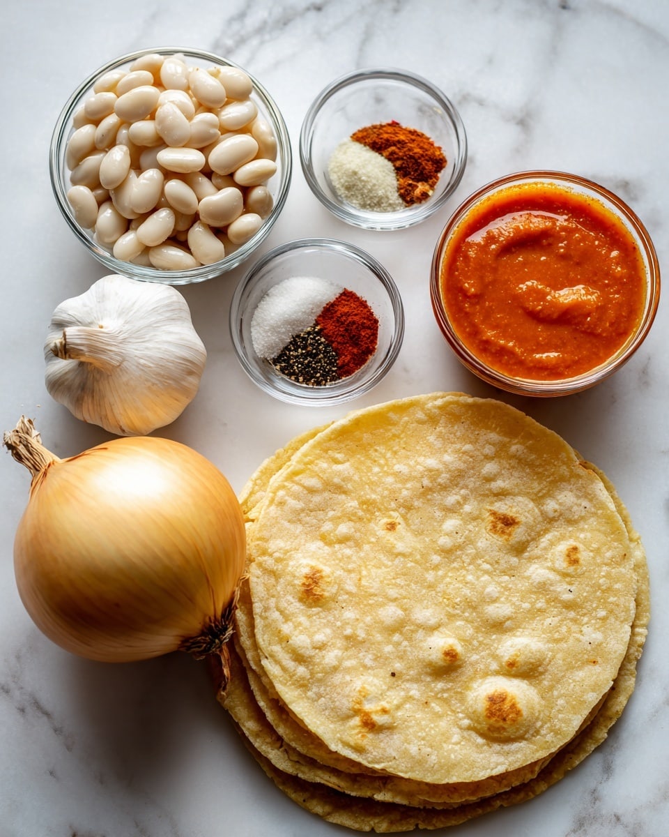 The image shows a round stack of pale yellow corn tortillas with a rough texture placed on a white marbled surface on the lower right side. Above them is a large, round yellow onion with smooth dry skin. To the left of the onion, a whole bulb of garlic with white to light beige papery skin rests on the surface. Above the garlic, a small glass bowl holds five separate piles of spices in white, black, red, and brown colors. In the upper right corner, a clear glass bowl contains bright orange-red buffalo sauce with a smooth surface. Next to this bowl, on the upper left, is a small clear glass jar filled with white beans soaked in liquid, visible through the glass. The setting has a simple and organized layout across a white marbled background photo taken with an iphone --ar 4:5 --v 7