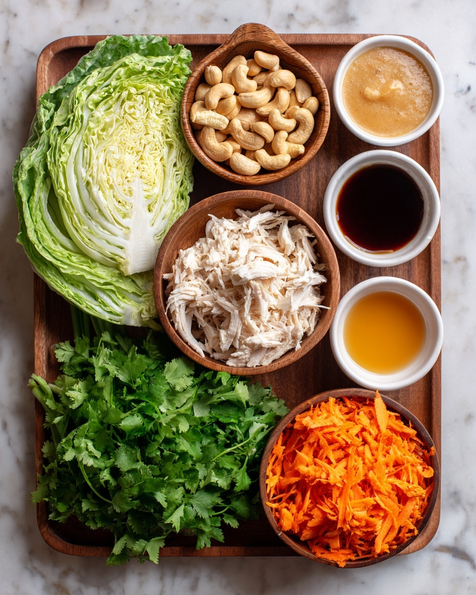 A wooden tray holds a fresh light and dark green cabbage cut in half positioned on the left side, next to a long green onion lying horizontally. At the top left corner is a small wooden bowl filled with light brown whole cashews. Below it, in the center top area of the tray, lies a bunch of fresh bright green cilantro. Below the cilantro, in the middle of the tray, is a small wooden bowl filled with shredded white and light brown chicken. Surrounding the cilantro and chicken are four small white bowls arranged in an arc from top right to bottom right. The top bowl contains dark brown tamari sauce, the next has thick amber maple syrup, followed by creamy tan tahini, and below that is light golden sesame oil. In the bottom right corner is another small wooden bowl packed with bright orange shredded carrots. The tray is placed on a white marbled surface. photo taken with an iphone --ar 4:5 --v 7
