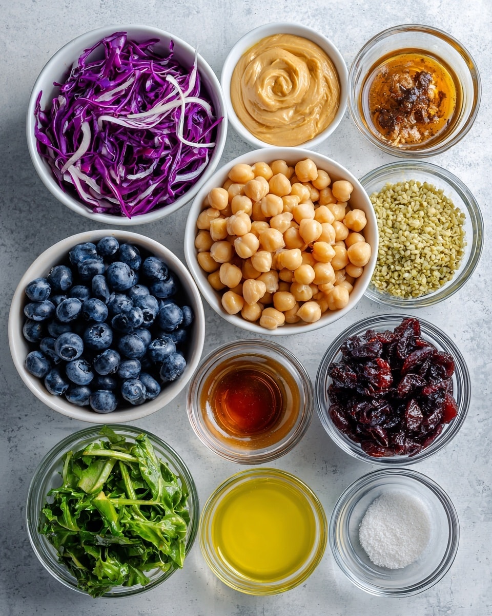 The image shows a flat lay of nine white bowls and small glass containers arranged neatly on a white marbled surface, each filled with different colorful ingredients. Starting from the top left, a white bowl holds bright shredded purple cabbage with thin white streaks. Next to it, a small glass bowl contains smooth, creamy tan tahini sauce. To the right, a small white bowl is filled with pale yellow-green hemp seeds with a grainy texture. Below the cabbage, a clear glass bowl is packed with shiny, round dark blue blueberries. In the center, a white bowl has light beige round chickpeas. Below the tahini is a small glass bowl with dark amber sweetener. To its right, a small glass bowl holds pale yellow lemon juice. Below the blueberries, a clear glass bowl contains dark red dried cranberries. Below the chickpeas is a white bowl filled with mixed green leaves, some dark and some light, with a fresh texture. On the right side, two small glass bowls contain white salt and light beige garlic powder. All items are neatly arranged in rows, showing clear contrast between colors and textures. Photo taken with an iphone --ar 4:5 --v 7