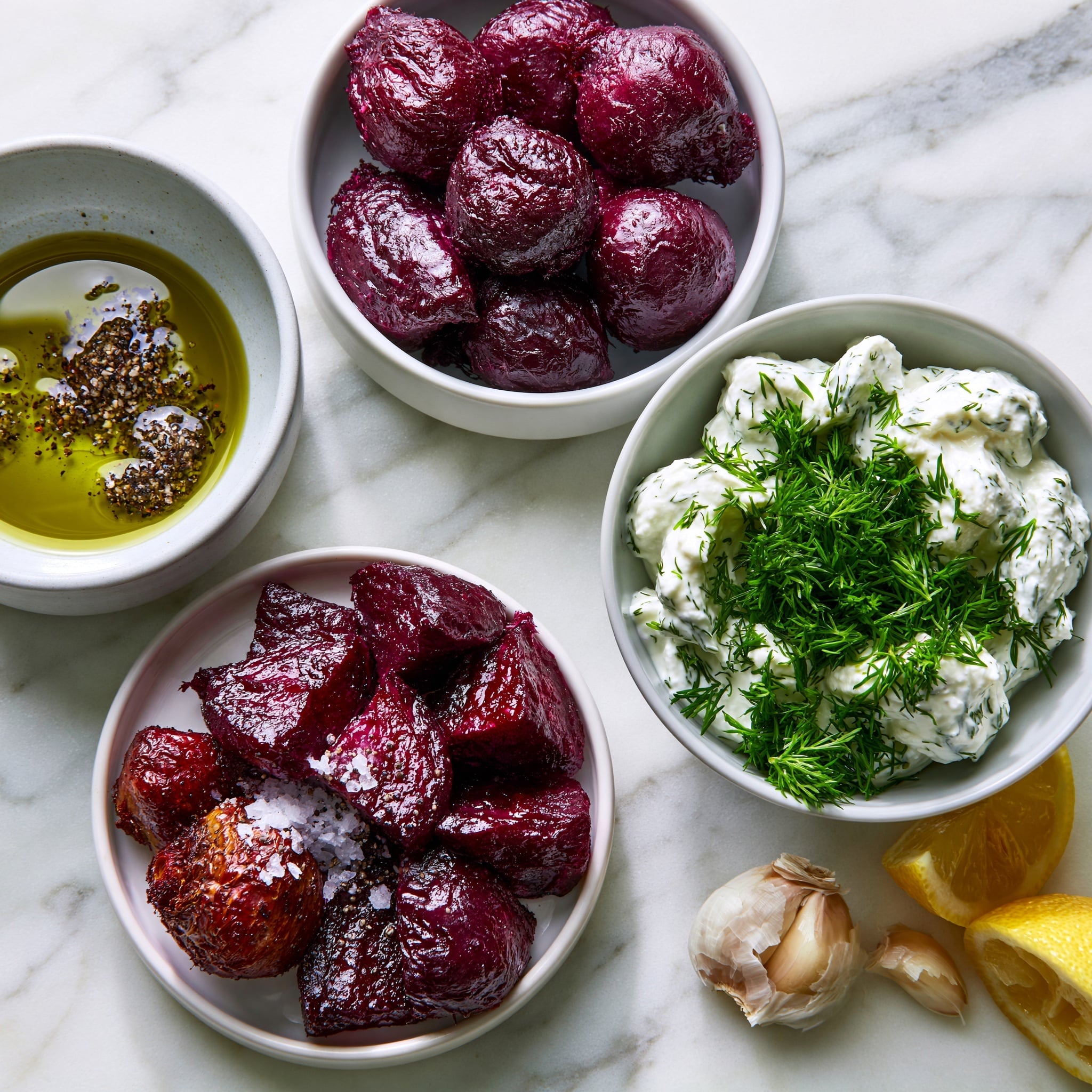 On a white plate, there is a swirl of light green creamy sauce with visible herb specks spread in a wide oval shape. On top, there are many dark red beet wedges arranged in a scattered way. Small golden toasted nuts and fresh green dill sprigs are sprinkled evenly over the beets and sauce. The plate is placed on a white marbled surface. photo taken with an iphone --ar 4:5 --v 7