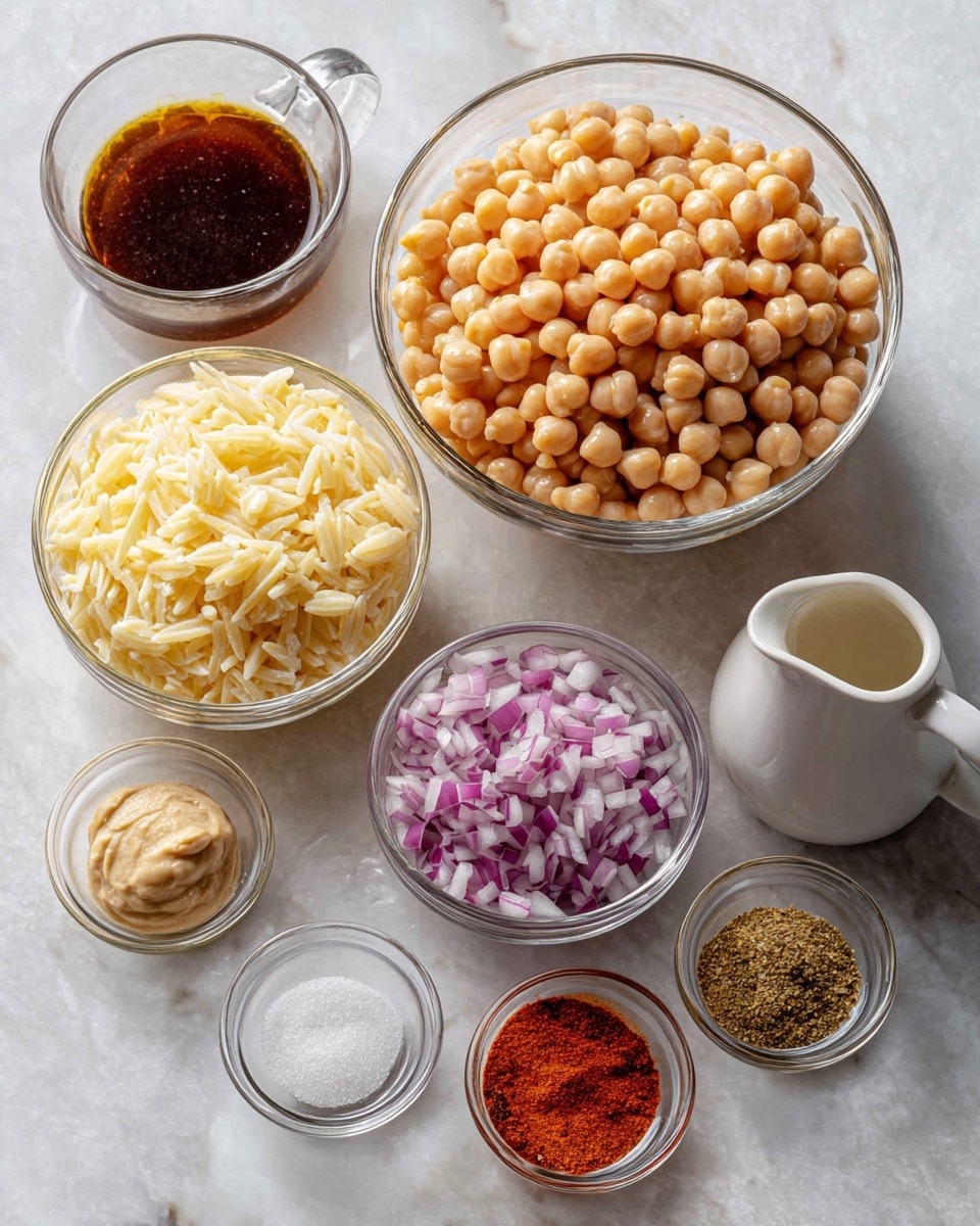 Several clear glass bowls and a white jug sit on a white marbled surface. In the back row, a large bowl filled with light beige chickpeas is on the right, and a white jug with dark brown liquid is on the left. In front of the large bowl, a smaller bowl holds finely chopped red onions. Center-left shows a glass bowl filled with uncooked orzo pasta, creamy yellow in color. In the front row, from left to right, there is a small bowl with a pale creamy paste, a tiny bowl containing two piles of powder—one white and one orange spice—and a small bowl with smooth red sauce. The arrangement is neat and well spaced. photo taken with an iphone --ar 4:5 --v 7